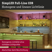 Moderne Bar mit Holztheke und farbiger LED-Beleuchtung für stimmungsvolle Raumgestaltung