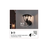 Black outdoor wall light with motion sensor and adjustable dusk-to-dawn function for home exterior.