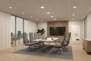 Modernes Büro mit grauen Bürostühlen und weißem Konferenztisch auf grauem Teppichboden