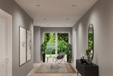 Modern hallway with grey walls, patterned rug, black sideboard, and recessed LED ceiling lights.