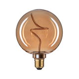 Round LED bulb with amber glass and decorative filament for ambient lighting in modern interiors