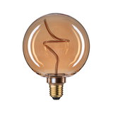 Round LED bulb with amber glass and decorative filament for ambient lighting in modern interiors