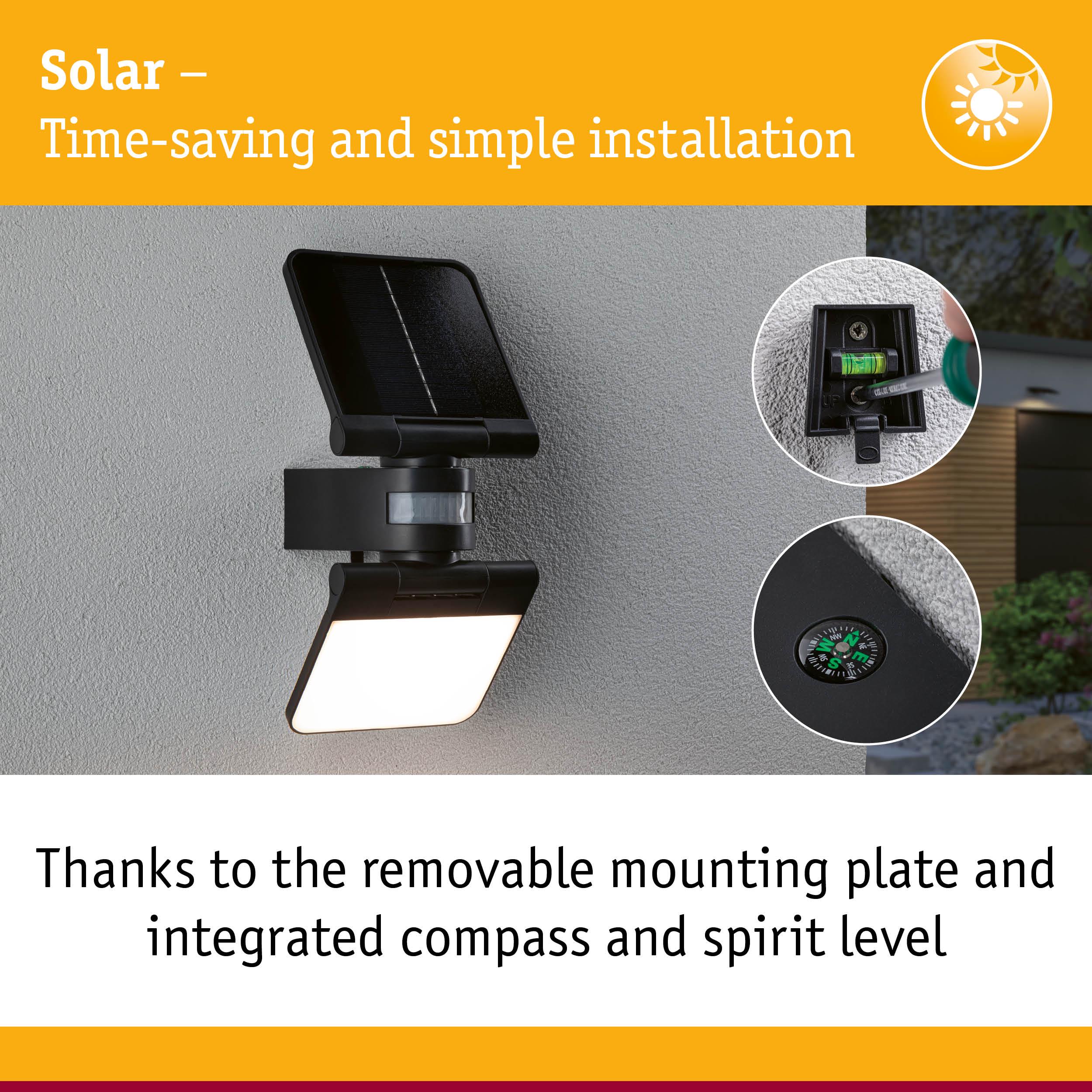 Black solar outdoor light with removable mounting plate, integrated compass and spirit level for easy installation