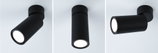 Drie zwarte metalen LED-plafondspots in verschillende posities voor moderne verlichting