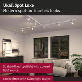 White URail Spot Luxe straight-lined spotlight with GU10 light source in a modern living room.