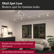 White URail Spot Luxe ceiling spotlight in modern living room with large windows