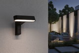 Schwarze LED-Außenwandleuchte aus Metall mit warmweißem Licht für moderne Gartenbeleuchtung.