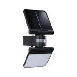 Black solar light with motion sensor and white LED panel for energy-saving outdoor lighting
