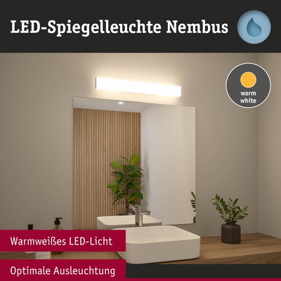 LED-Spiegelleuchte Nimbus mit warmweißem Licht über Badspiegel und Holzarbeitsplatte mit Pflanzen