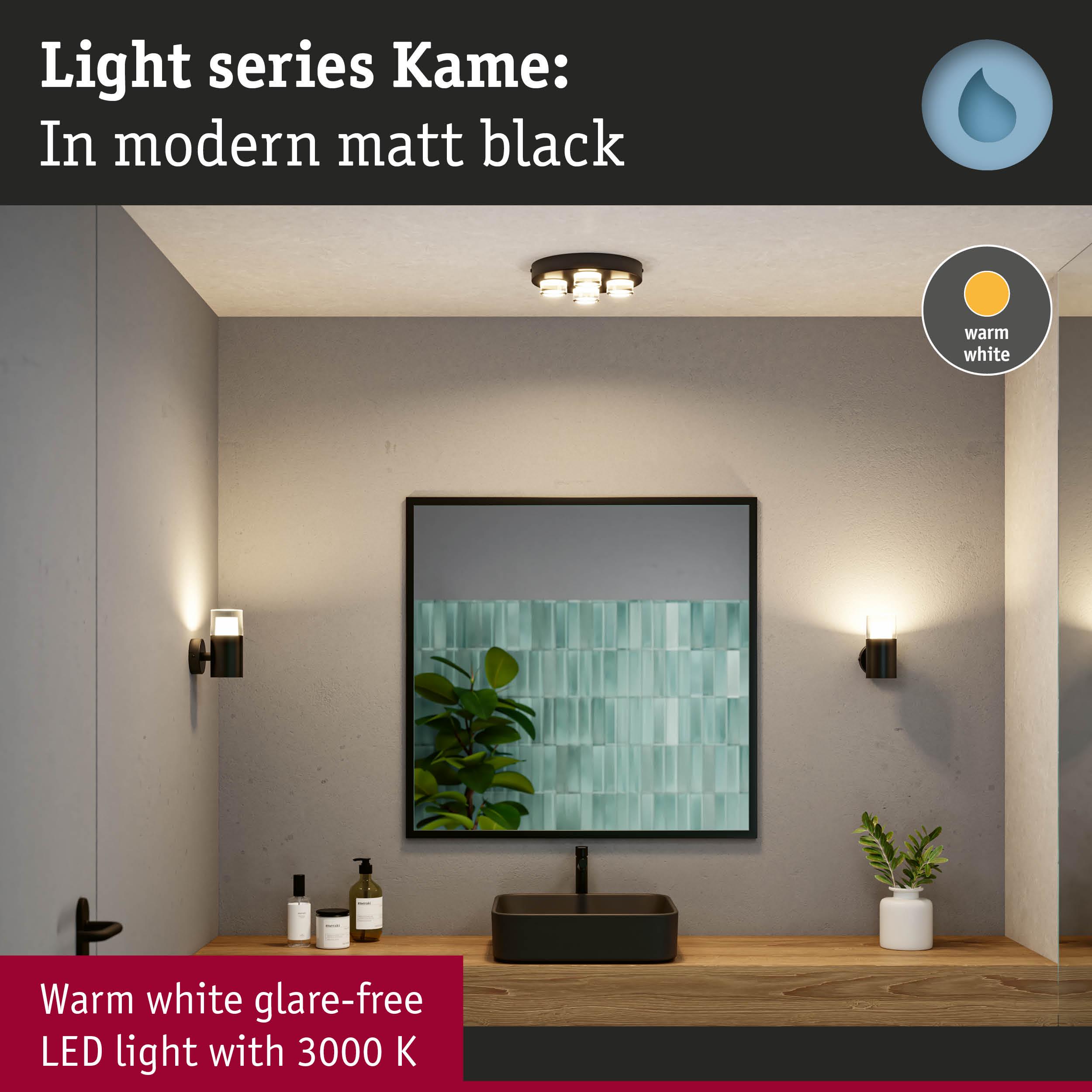 Matt black LED wall and ceiling lights with warm white glow in modern bathroom setting