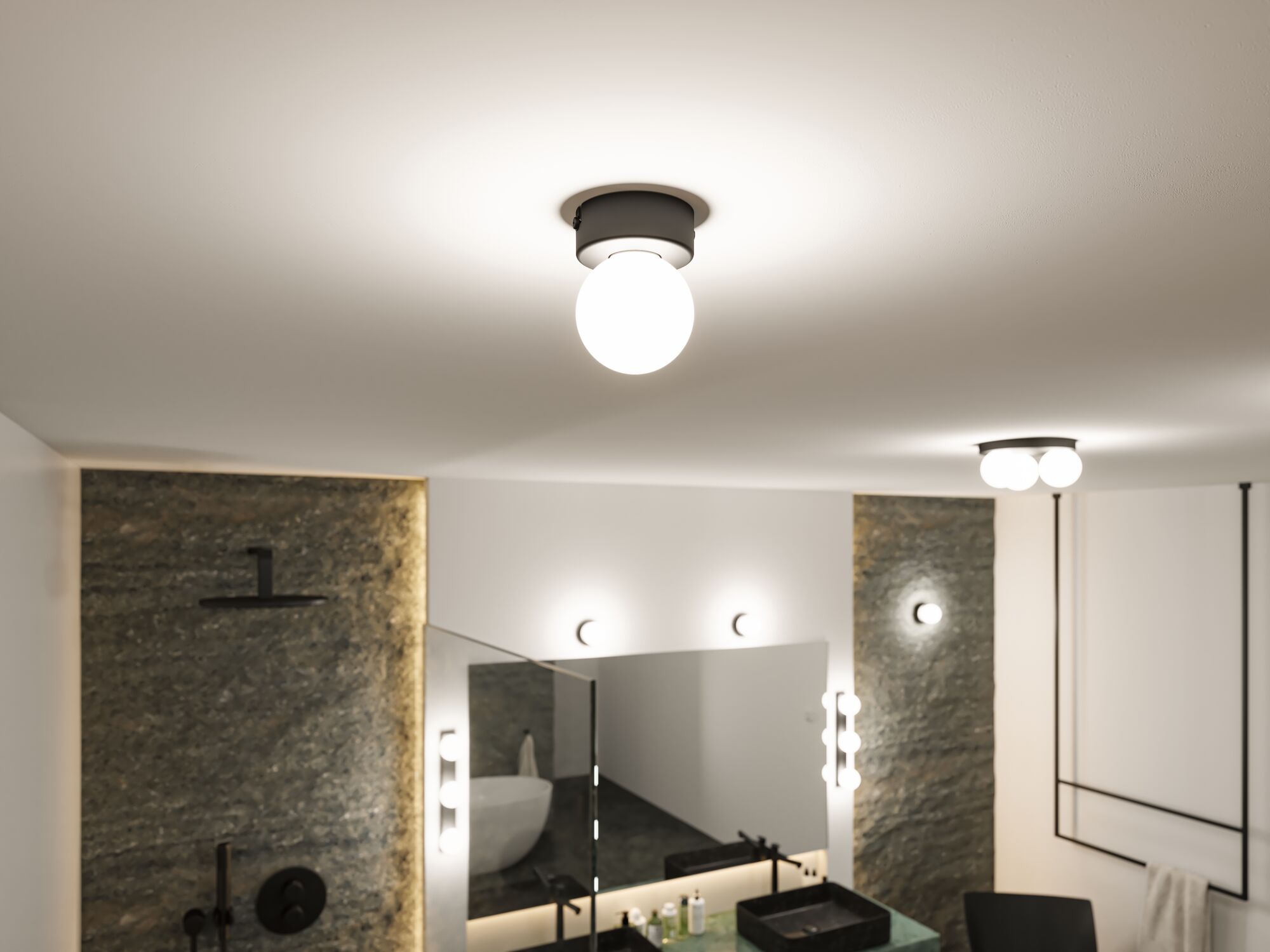 Round ceiling light with white glass and black metal frame in modern bathroom with mirror and sink.