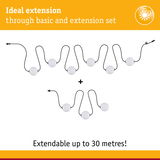 Extendable LED string lights with white globes and black cable, ideal for decorative lighting up to 30 meters