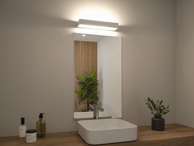 Modern white sink on wooden countertop with rectangular mirror and white LED wall light