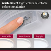 White LED ceiling light with selectable light colour before installation showing warm, neutral, and daylight white.