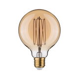 Round LED bulb with amber glass and visible filament for decorative lighting and warm ambiance