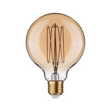 Round LED bulb with amber glass and visible filament for decorative lighting and warm ambiance