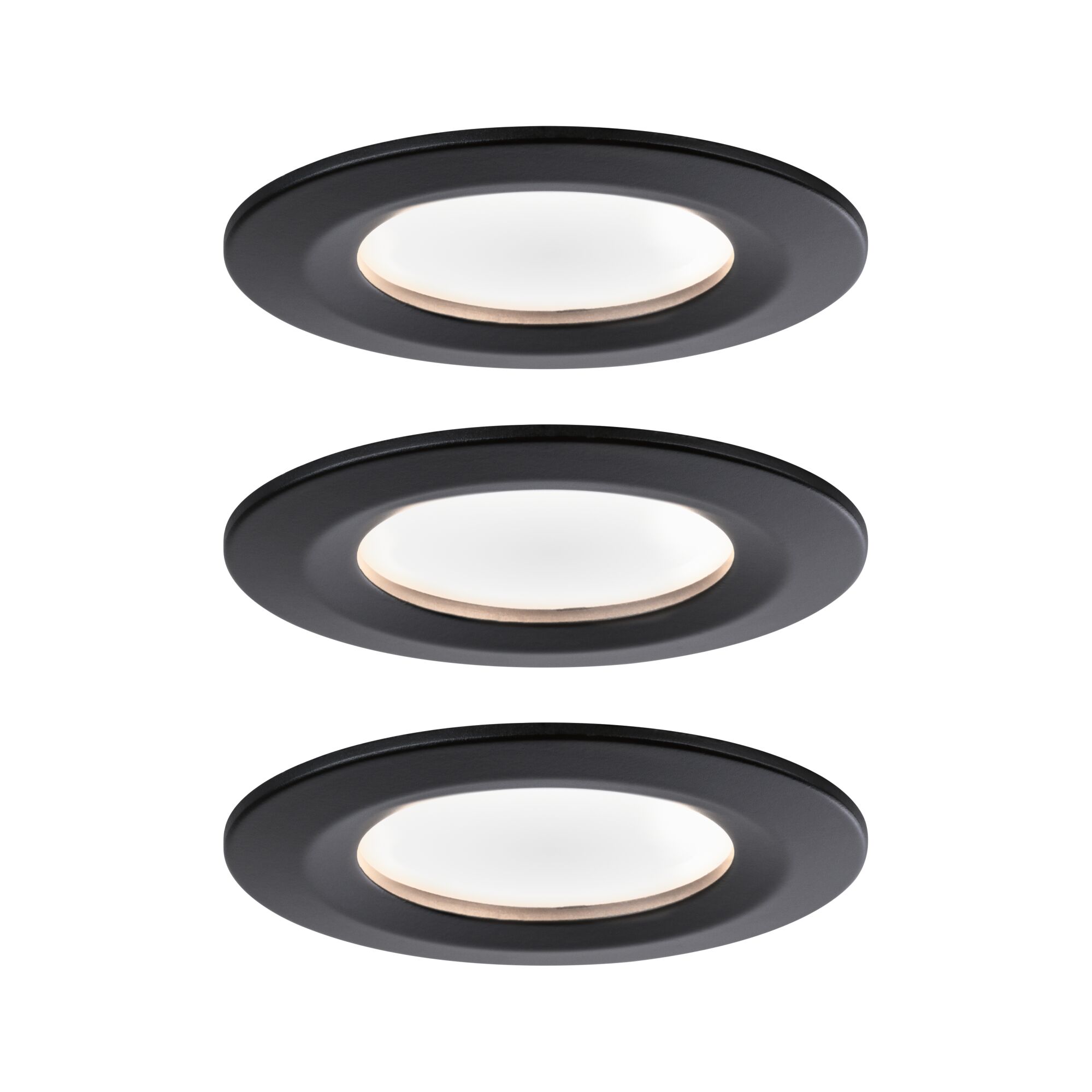Three round black LED recessed lights with warm white light for modern room illumination