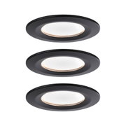 Three round black LED recessed lights with warm white light for modern room illumination