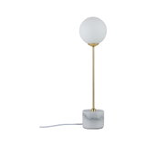 Modern table lamp with white glass globe shade, gold metal rod, and gray marble base for interior lighting