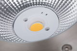 Close-up of LED spotlight with silver reflector and yellow light source core for lighting solutions