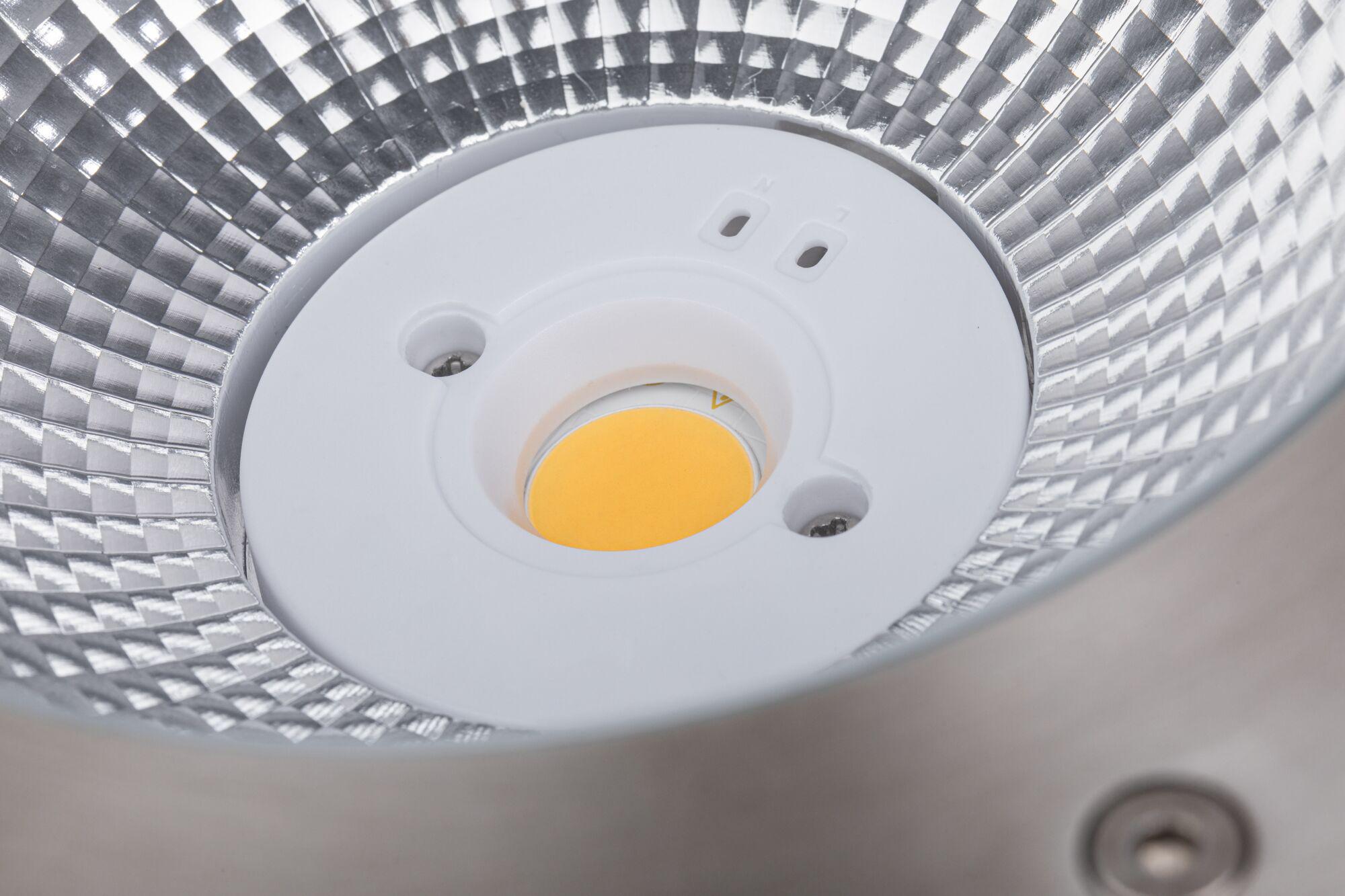 Close-up of LED reflector with silver aluminium surface and yellow light source core