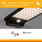 Black solar LED light with integrated motion sensor and 120° detection angle for outdoor use