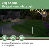 Garden path with warm white LED plug lights creating atmospheric outdoor lighting