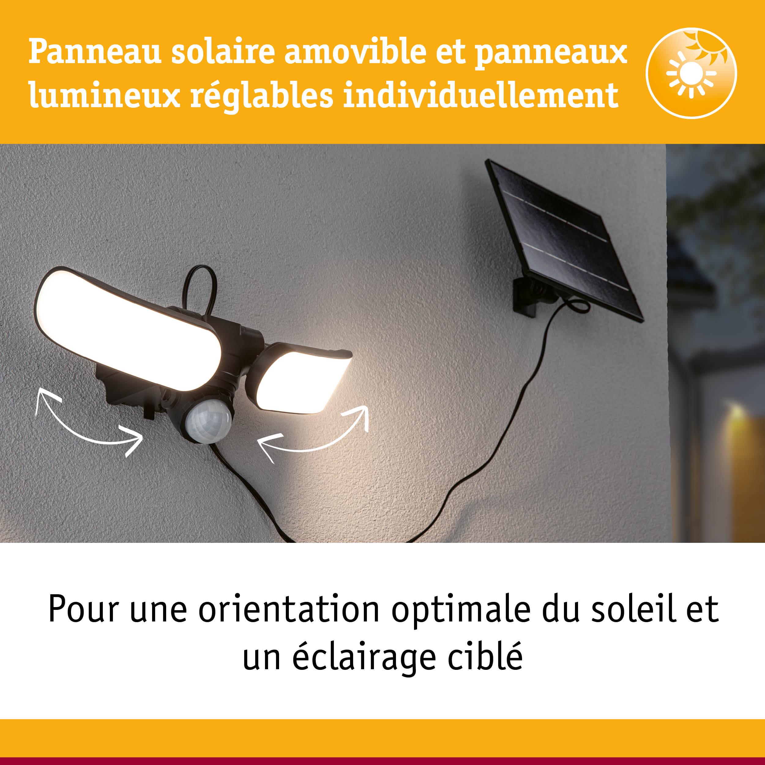 Éclairage solaire noir avec deux panneaux LED réglables fixé sur mur gris pour un éclairage extérieur ciblé