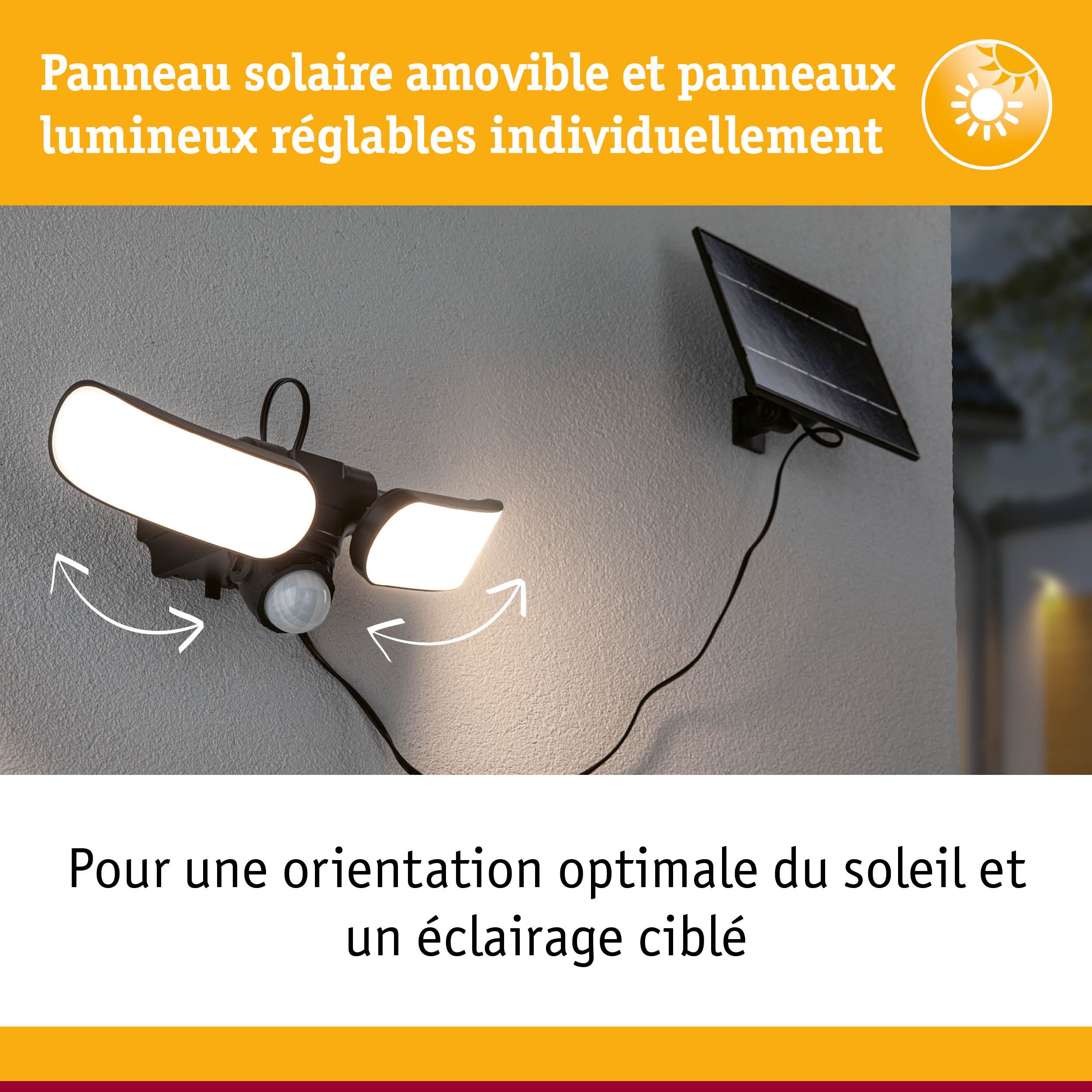 Lampe solaire noire avec panneaux LED réglables et panneau solaire fixée sur mur gris extérieur