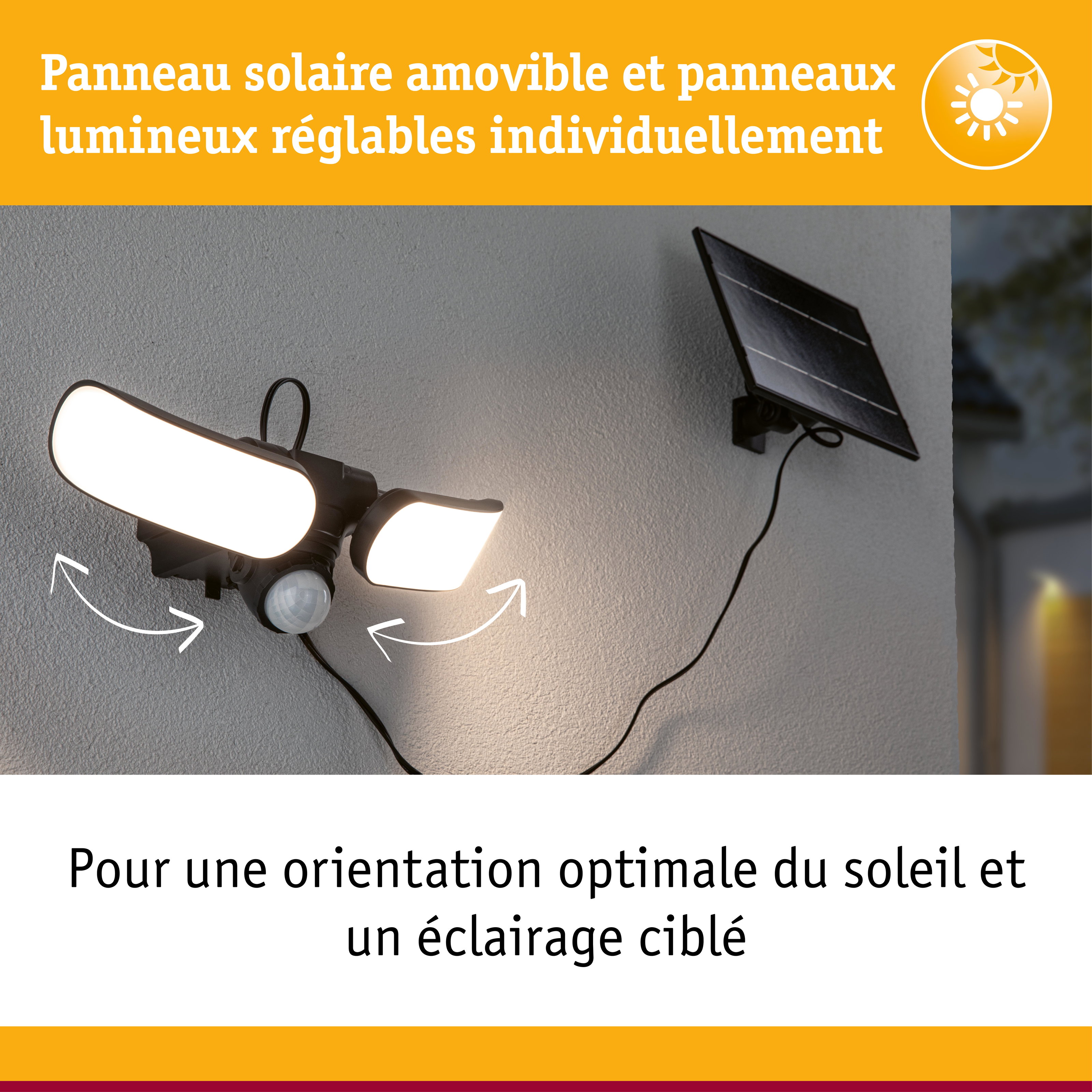 Lampe solaire noire avec panneaux LED réglables et panneau solaire fixée sur mur gris extérieur