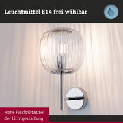 Wandlampe mit transparentem Glas und verchromtem Metall, flexibel einstellbar für moderne Lichtgestaltung
