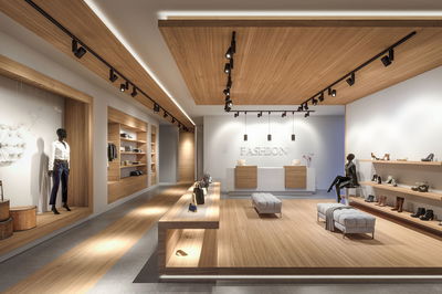 Modernes Modegeschäft mit Holzdecke, LED-Schienenstrahlern und minimalistischer Ladeneinrichtung mit Schuhen und Taschen.