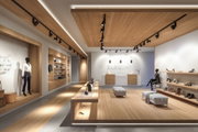 Modernes Modegeschäft mit LED-Schienenbeleuchtung und minimalistischer Inneneinrichtung in Grau und Holz.