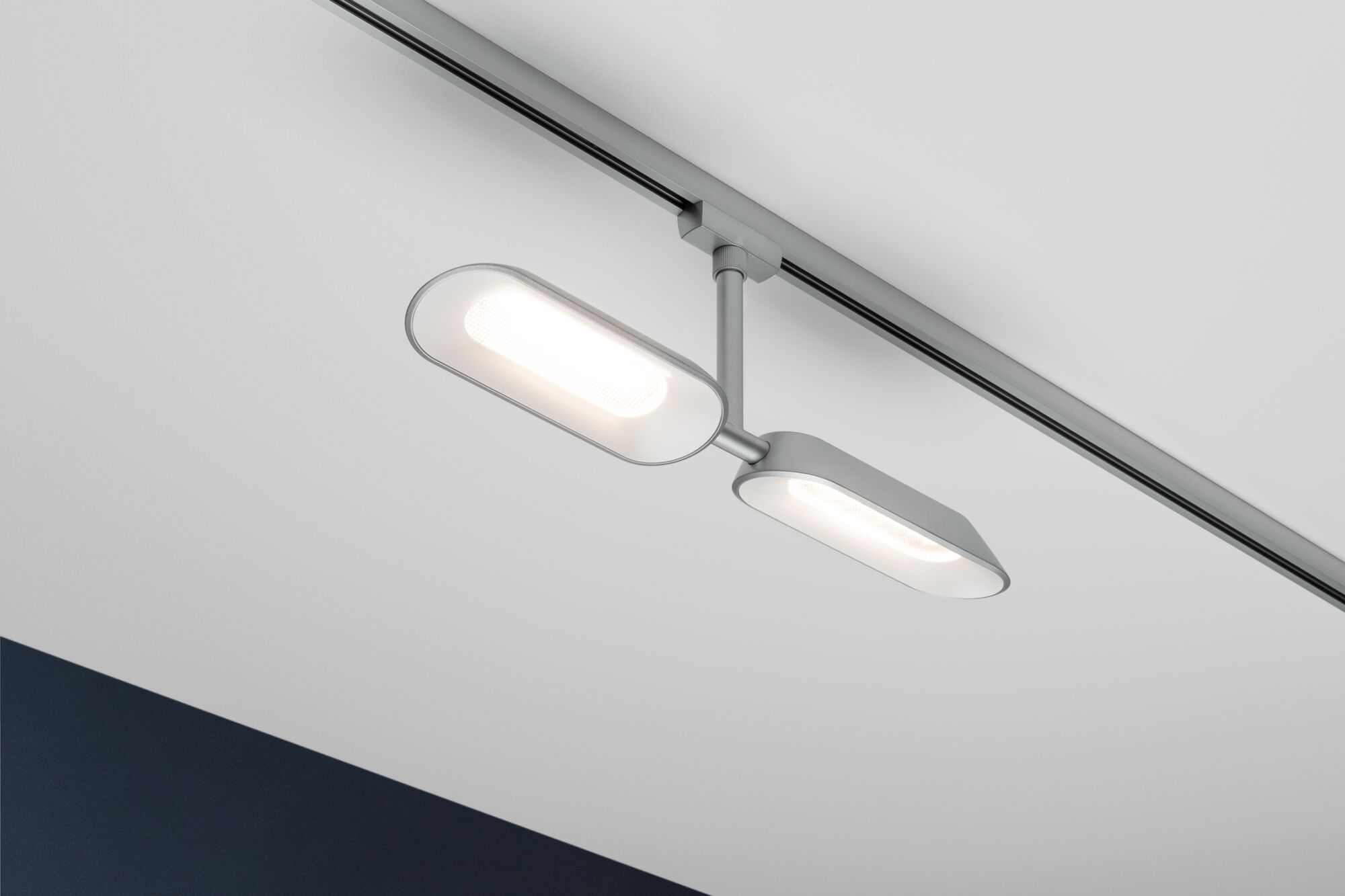 Modern silver aluminium LED track light with oval light panels for stylish home lighting