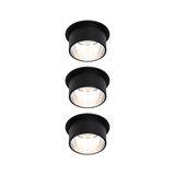 Three black metal recessed LED spotlights with warm white light for modern room lighting