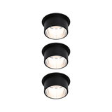 Three black metal recessed LED spotlights with warm white light for modern room lighting
