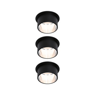 Three black metal recessed LED spotlights with warm white light for modern room lighting