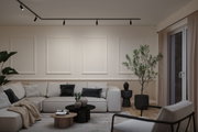 Modernes Wohnzimmer mit schwarzer Paulmann LED-Schienenbeleuchtung und beigem Sofa in neutralen Tönen