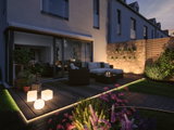 Modern terrace with LED floor lighting and three white plastic glowing cubes for garden and outdoor use.