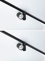 Spot LED noir en métal sur rail pour éclairage flexible et mise en valeur des espaces