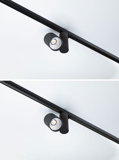 Spot LED noir en métal sur rail pour éclairage flexible et mise en valeur des espaces