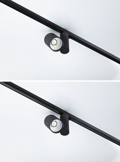 Schwarzer LED-Spot aus Metall an Schienensystem für flexible Raumbeleuchtung und Akzentsetzung