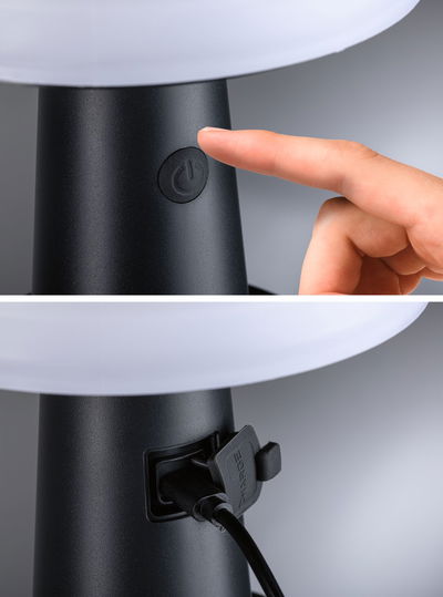 Black lamp base with power button and charging port for LED table lamp made of plastic.