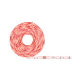 Roll of red LED strip light with flexible plastic base for decorative lighting use.