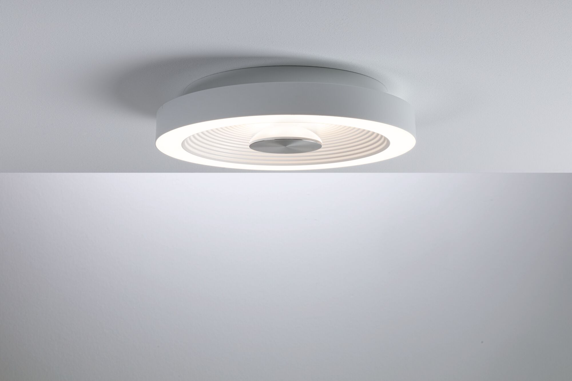 Round white LED ceiling light with integrated diffuser and modern design for living spaces.