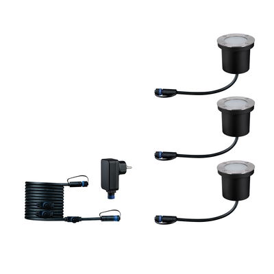 Set of three black metal LED ground lights with cables and power adapter for outdoor lighting