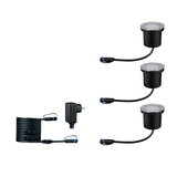 Set of three black metal LED ground lights with cables and power adapter for outdoor lighting