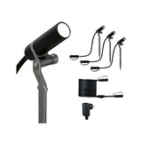 Zwarte LED-tuinschijnwerper set met grondpennen, kabel en adapter voor buitenverlichting.