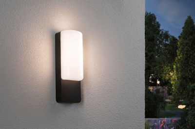 Modern outdoor wall light with black metal frame and white glass for garden lighting.