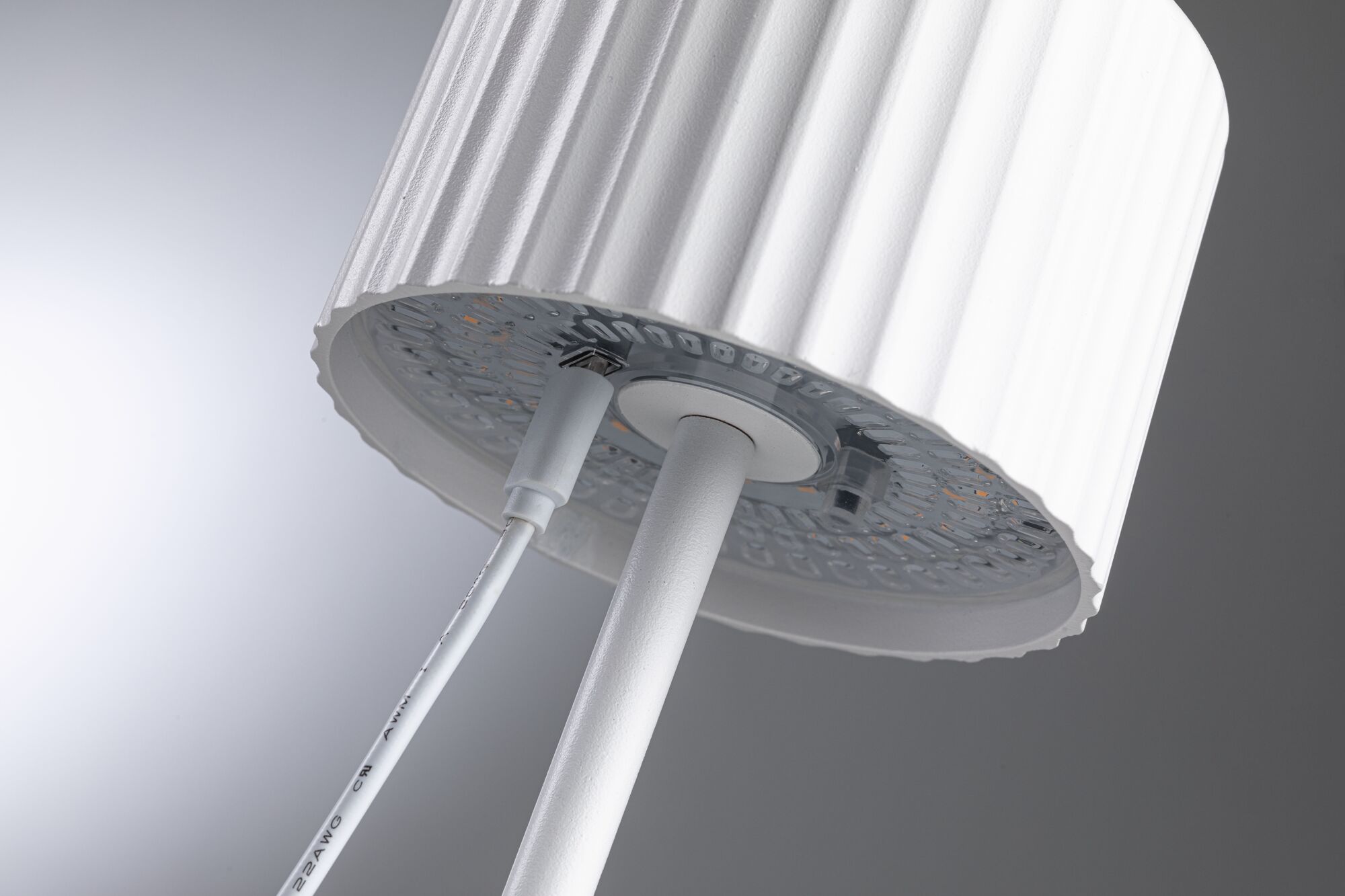 White LED floor lamp with ribbed shade and built-in USB port for modern lighting solutions